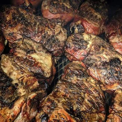 Whole BBQ Shoulders still on the pit.