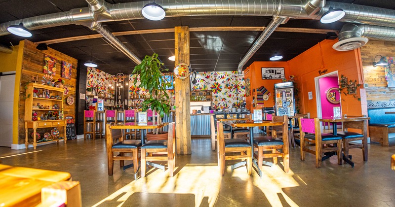 Interior, tables and chairs ready for guests