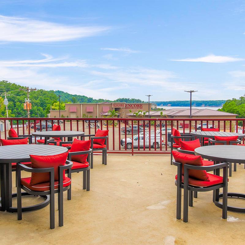 Tables and chairs outside on the patio.