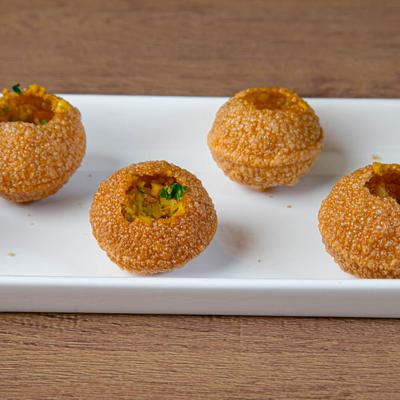 Fried puff-pastry balls with spiced mashed potato filling.