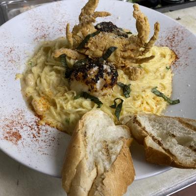 angel hair alfredo w/ blackened diver scallops, shrimp & fried buster soft shell crab.