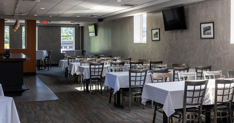 Interior, tables set for guests