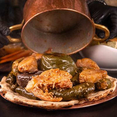 Dolmas being served on a plate.