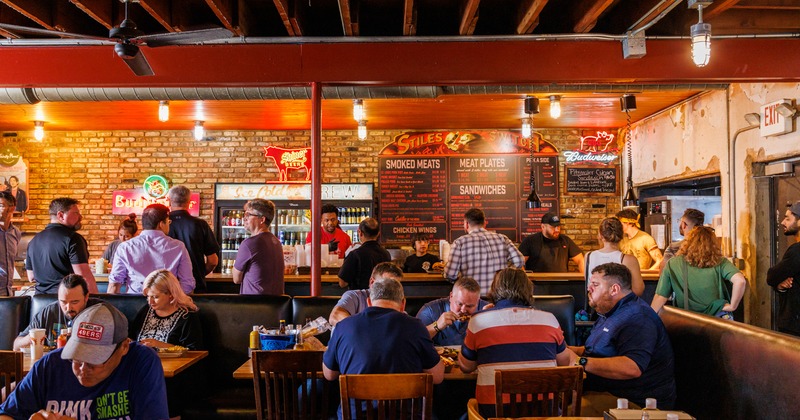 Interior, guests in the dining area and at the order counter