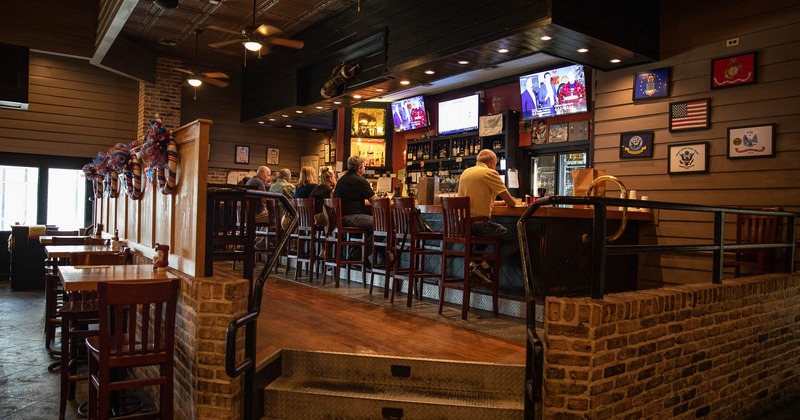 Interior, bar with seated guests