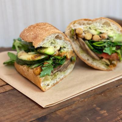 Rustic Vegan sandwich with shiitake, zucchini, spiced chickpeas, greens and tomatoes.