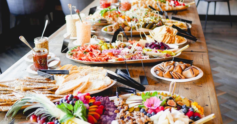 Catering table spread with various dishes