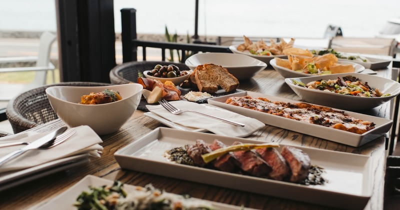 Assortment of dishes served on a outdoor table