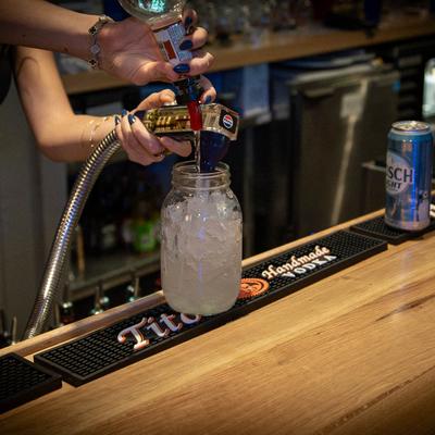 Hands preparing a beverage.