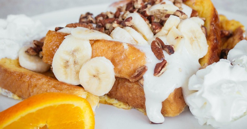 Banana Nut French Toast garnished with an orange slice