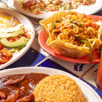 Assorted food plates on a table, close up.