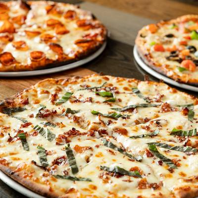 Goat cheese and bacon pizza, with basil, and garlic aioli.