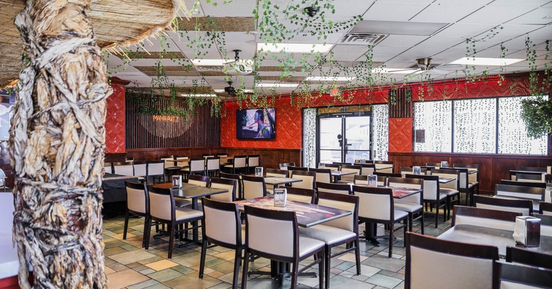 Interior, tables and chairs in dining area