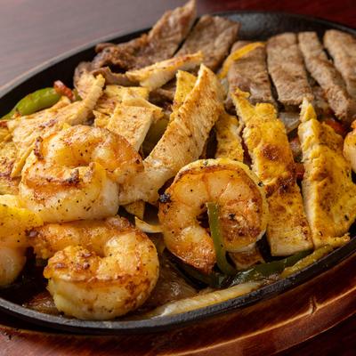 Chicken, shrimp, and steak Fajitas.