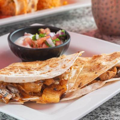 Grilled chicken and pineapple quesadilla served with fresh salsa.