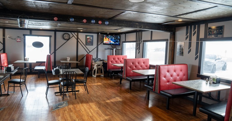 Restaurant interior with red booth seating