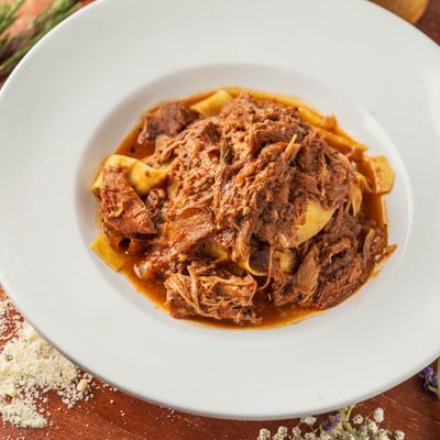 Pasta topped with rich meat sauce.