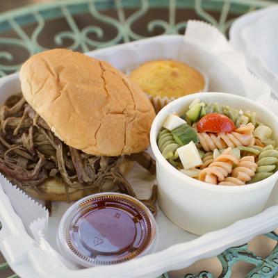 Pulled brisket sandwich and pasta salad.
