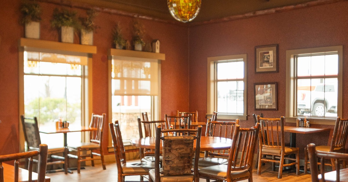 Interior, disco ball above tables and chairs