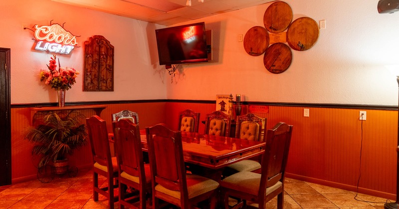Interior, table ready for guests, TV on the wall