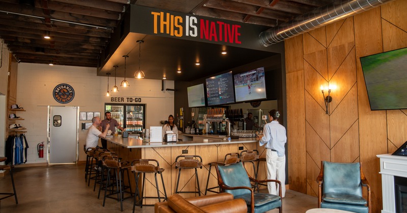 Interior, bar, bartender, guests, stools