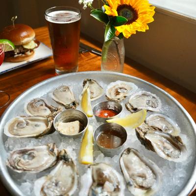 Oysters on ice and drinks.