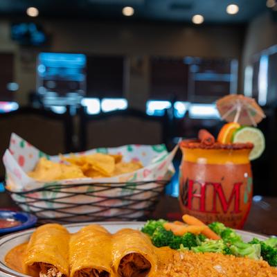 Enchiladas and Cantarito cocktail.