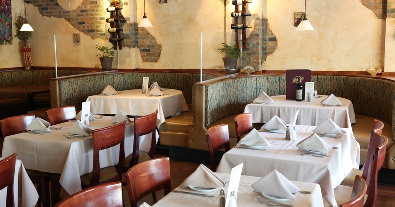 Interior, dining tables set with tableware