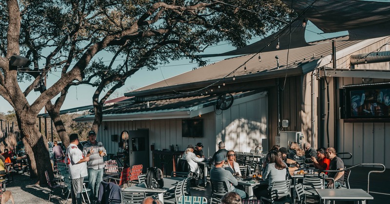 Outdoor seating area, customers eating and drinking