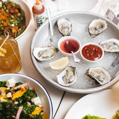 Shucked Oysters, with cocktail and mignonette sauces.