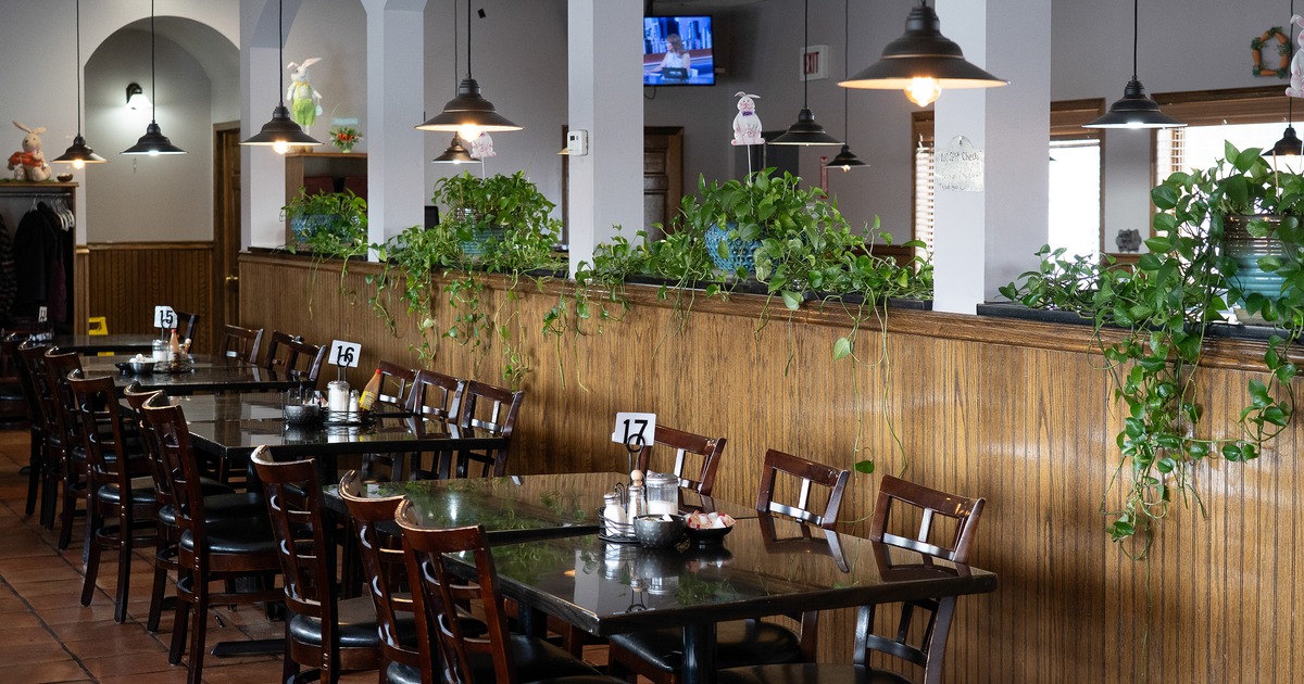 Cozy interior dining area with wooden tables and chairs