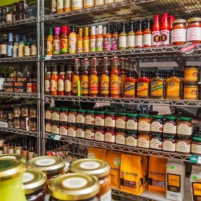 Interior, store racks stacked with products.