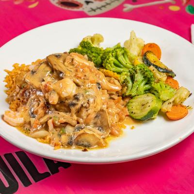 Texas Chicken with a side of vegetables.