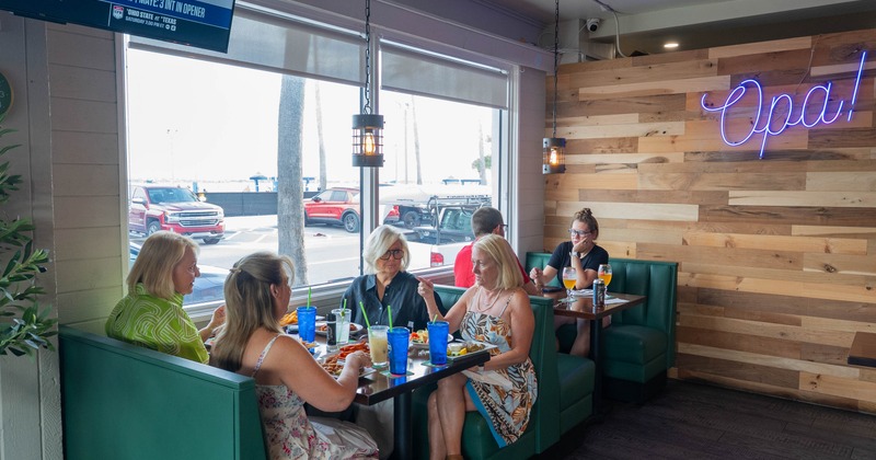 Interior, seating space with green leather booths
