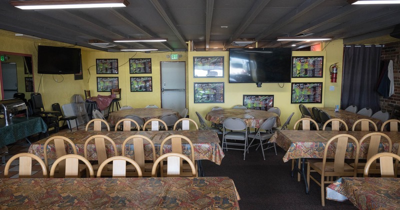 Interior, spacious seating area with tables and chairs