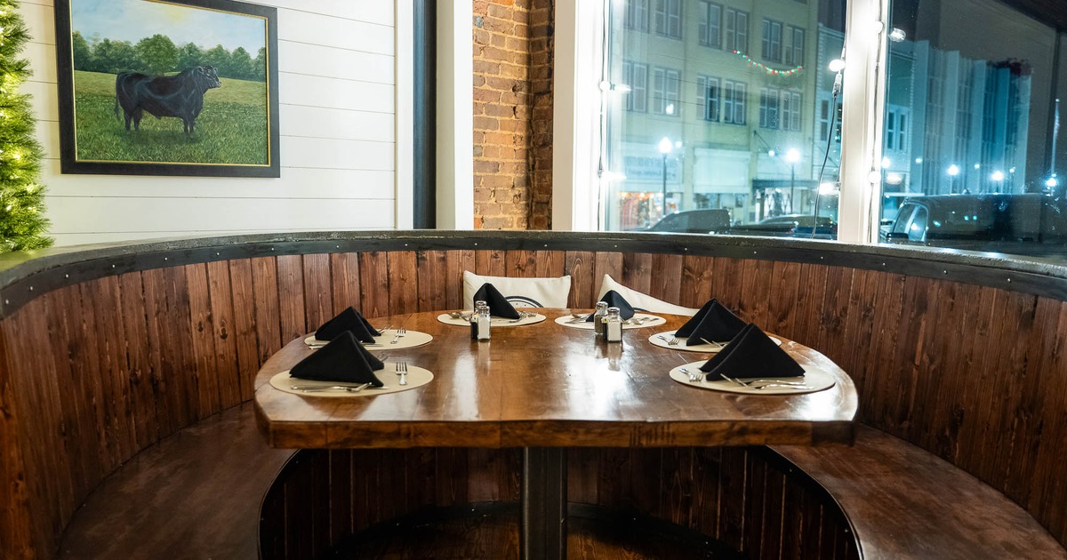 Interior, seating place with large windows behind