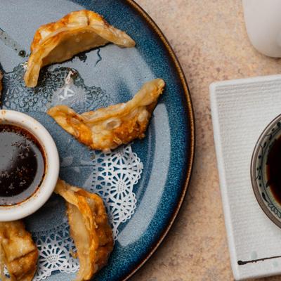Fried gyoza with dipping sauce.