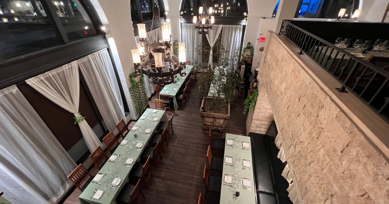 View of ground floor dining room with large tables setup