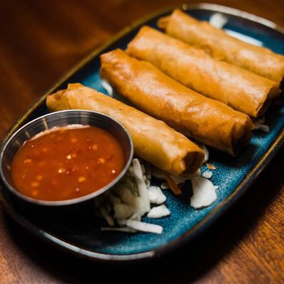 Chicken spring rolls served with house sweet chili.