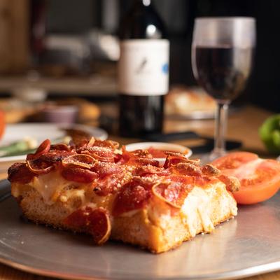 Pizza pastry with cheese and meat closeup