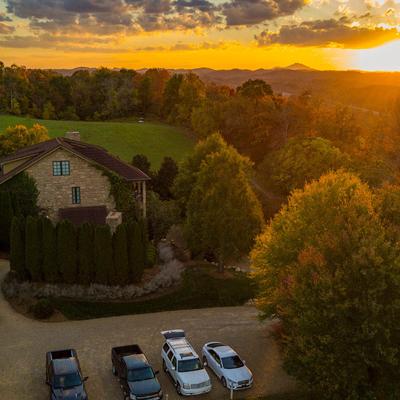 A vide view of the building and the parking lot.