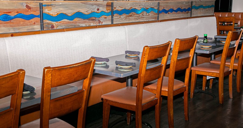 Interior, banquette seating area, tables and chairs ready for guests