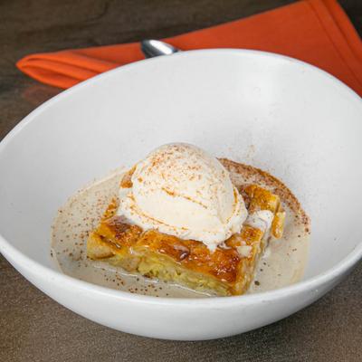 House-made bread pudding with whiskey butter cream and vanilla ice cream.