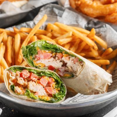 Chicken Bacon Ranch Wrap served with fries.