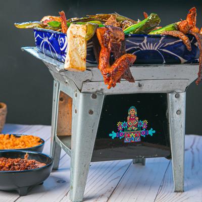 Fajitas on a brasero grill.