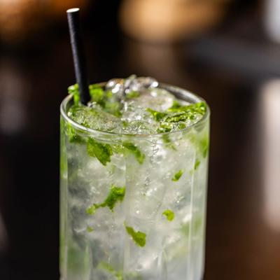 Mojito cockatil served in a highball glass, close-up.
