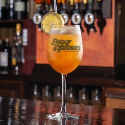 Orange cocktail in tall glass