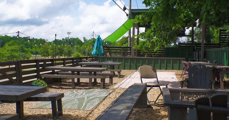 Cozy outdoor seating area with tables and benches