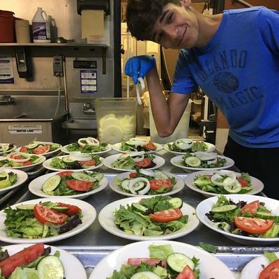 Lleyton making salads..