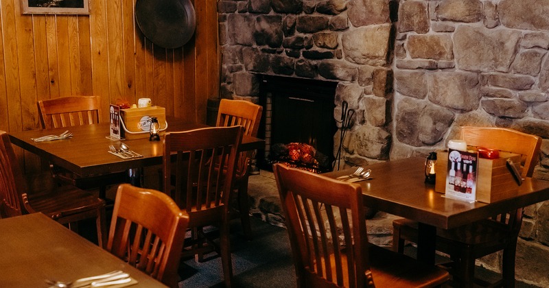 Restaurant interior, dining tables near the fireplace